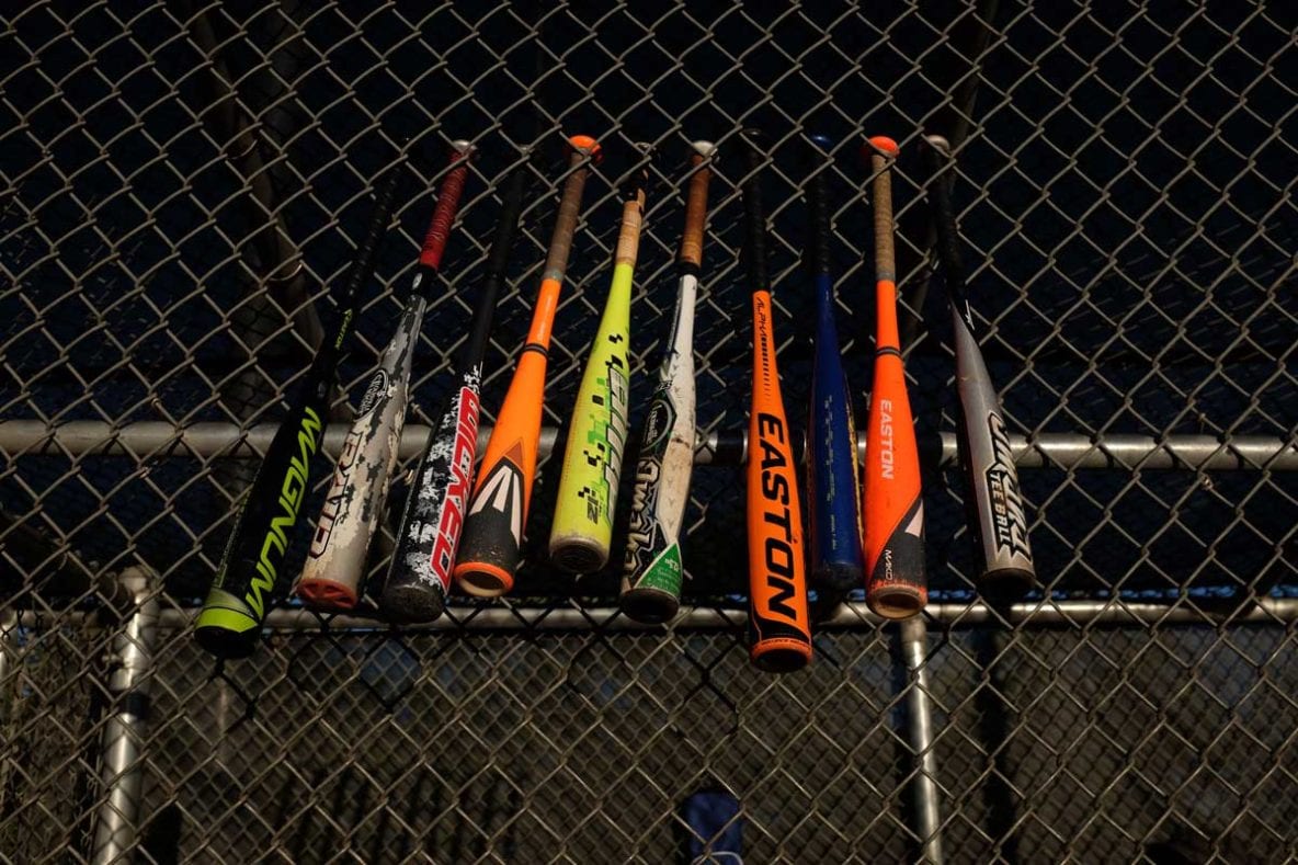 Baseball Bats on a fence